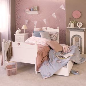 solid hardwood love bed, white, with trundle ready for sleepover, in bedroom with fireplace